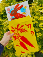 Load image into Gallery viewer, Mark hearld screenprint of a red rabbit sticking out of a yellow enverlope with a bright red carrott printed on the front.